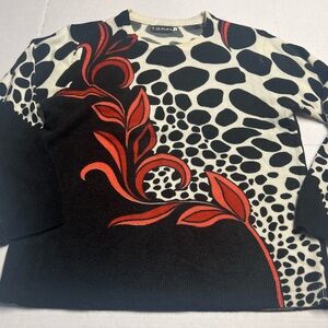 Black and White Sweater with Red Leaf Design